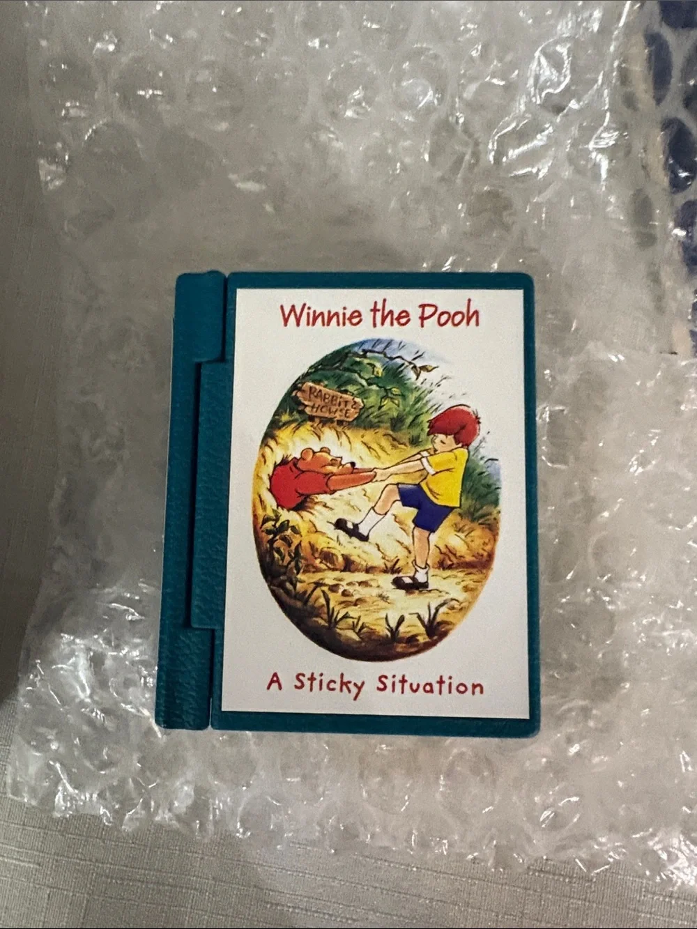 Hallmark Teal and Yellow Winnie the Pooh Mini Book Ornament 2004 NIB